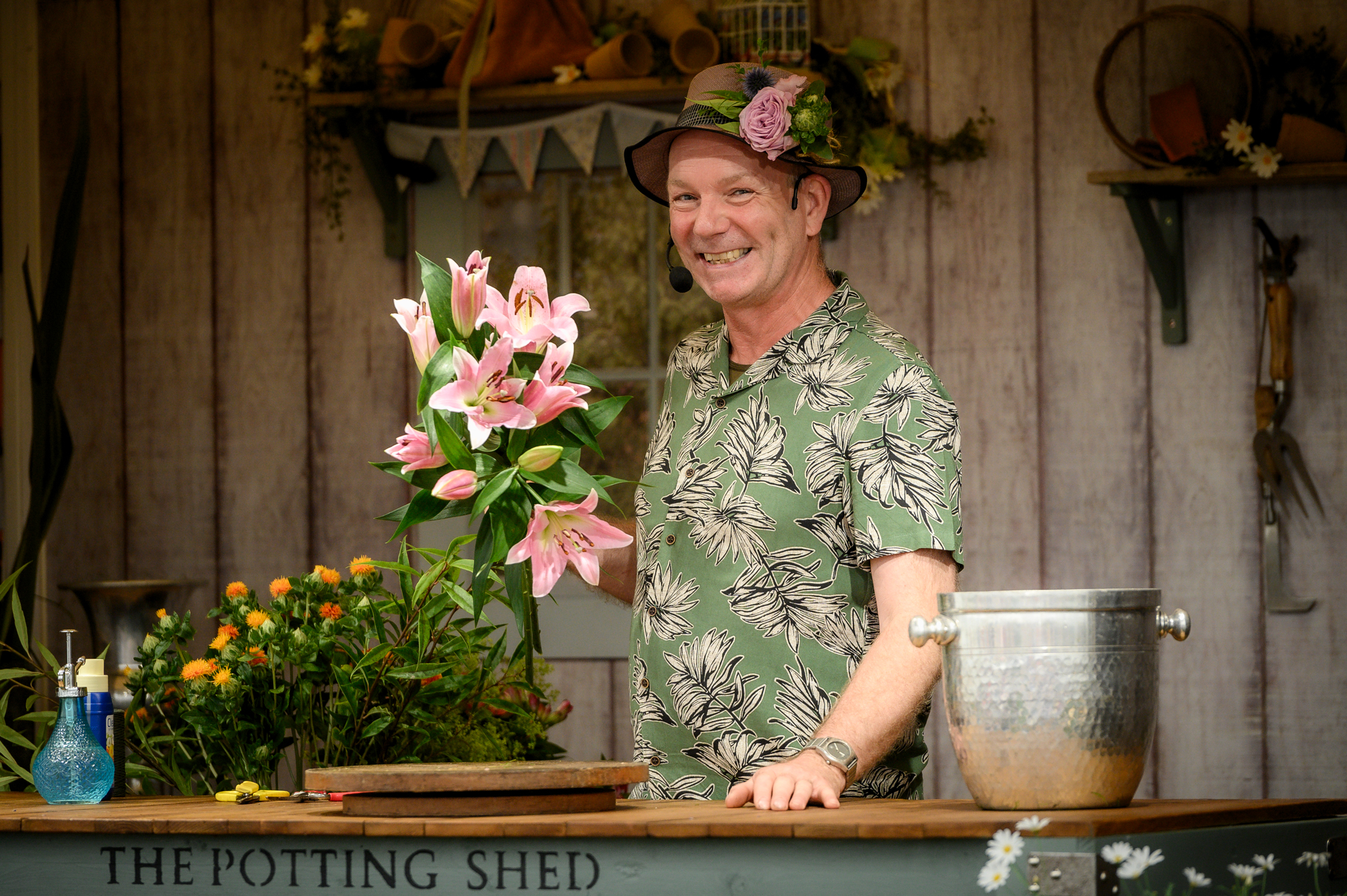Man doing a demonstration with flowers in his hands